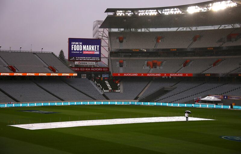 Cricket - Test Match - New Zealand v England - Eden Park, Auckland, New Zealand, March 24, 2018. Umpire Wayne Knights stands near the covered pitch shortly before announcing play has been abandoned due to rain on the third day of the first cricket test match.   REUTERS/David Gray