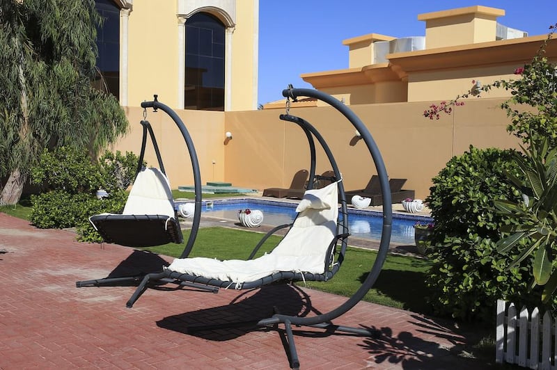 Moira Pirzad says they want their clients to come in and feel like it is their own home. Above, hanging chairs in the spa garden area of at De La Mer Day Spa. Sarah Dea / The National