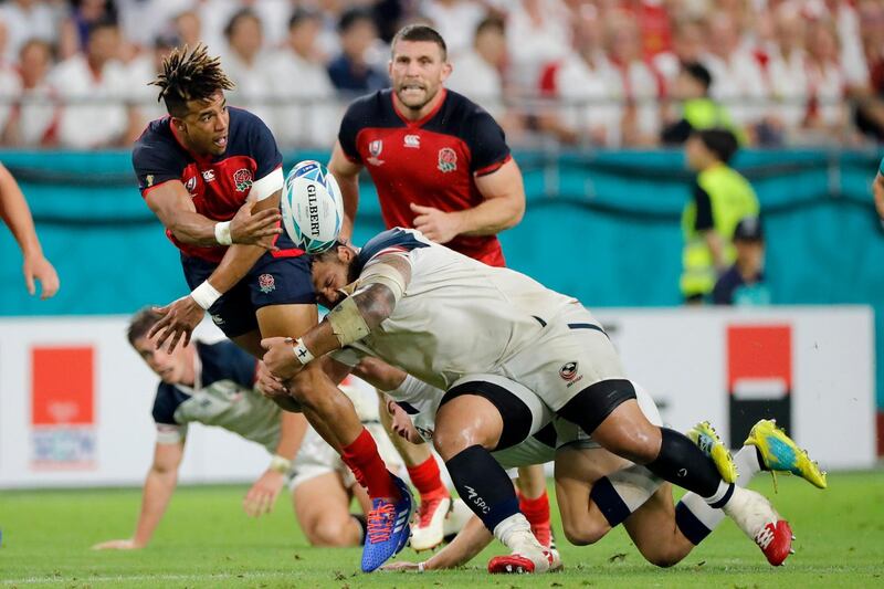 England's Anthony Watson passes the ball during the Rugby World Cup Pool C game at Kobe Misaki Stadium. AP
