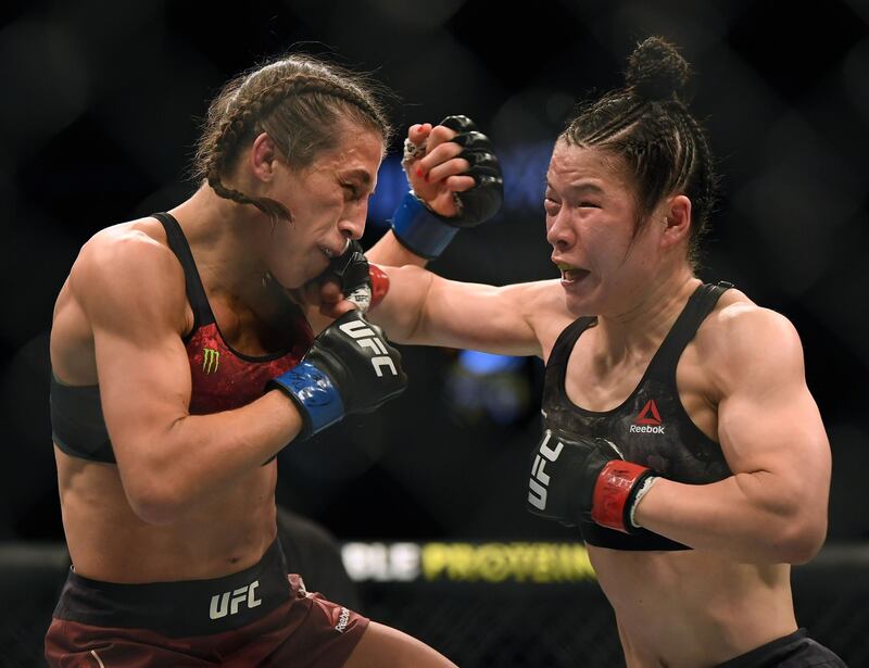 Weili Zhang lands a punch on Joanna Jedrzejczyk during their fight at UFC 248. AFP