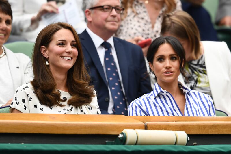 Tennis fans, Kate Middleton and Meghan Markle at Wimbledon in 2018. Getty Images