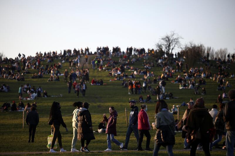 Members of the public walk in a crowded Primrose Hill, London. Reuters