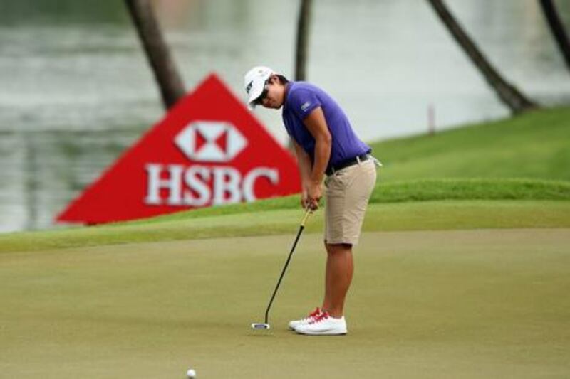 Tseng Yani lines up a putt.