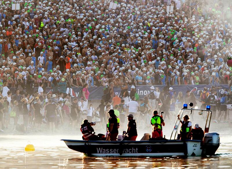 3,500 athletes wait for the start of the Ironman Triathlon in Frankfurt, Germany.  AP