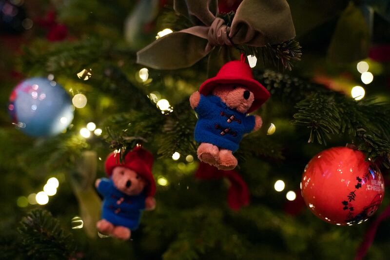 Paddington Bear decorations on a Christmas tree at Westminster Abbey. The fictional bear featured in a sketch with the late queen Elizabeth II to mark her platinum jubilee in the summer. AFP