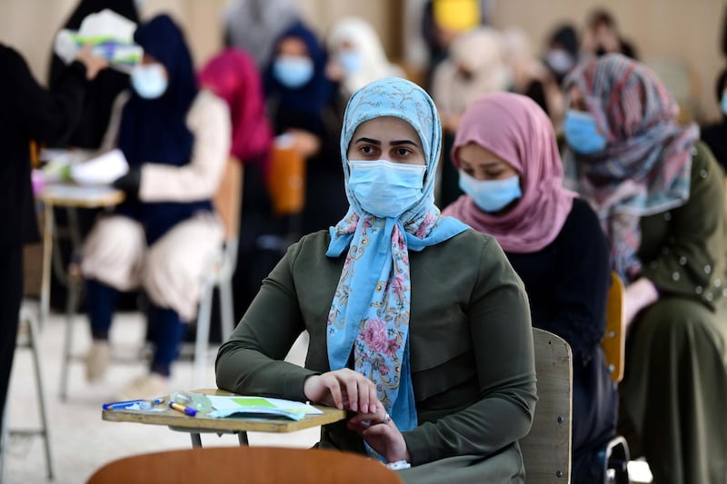 Iraqi high school students during their final exam after five months of school closures due to the coronavirus pandemic, at a school in Baghdad, Iraq.  EPA