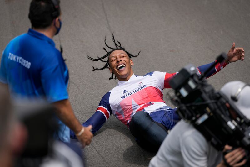 Kye Whyte of Britain lays on the track after winning the silver medal in the men's BMX Racing final.
