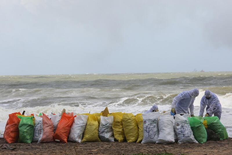 Bags of debris collected after washing ashore from damaged containers on the burning cargo vessel 'MV X-Press Pearl' off the coast of Negombo, about 31km north-west of Colombo. EPA
