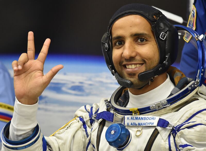 epa07868726 Member of the main crew to the International Space Station (ISS) United Arab Emirates' astronaut Hazza Al Mansouri waves before boarding a Soyuz rocket to the International Space Station (ISS) at the Russian-leased Baikonur cosmodrome in Kazakhstan, 25 September 2019. Mansouri will be the first Emirati in space.  EPA/VYACHESLAV OSELEDKO / POOL