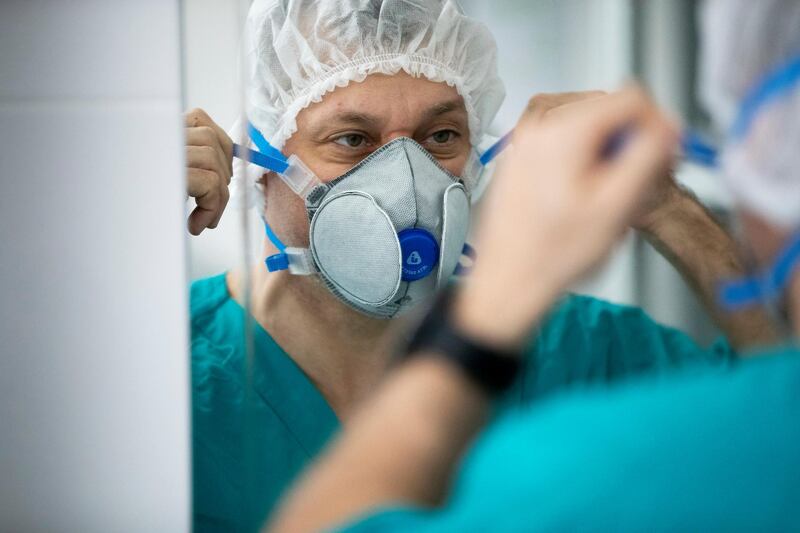 Dr Osman Osmanov puts on protective gear before his shift at an intensive care unit of the Filatov City Clinical Hospital in Moscow, Russia. AP Photo