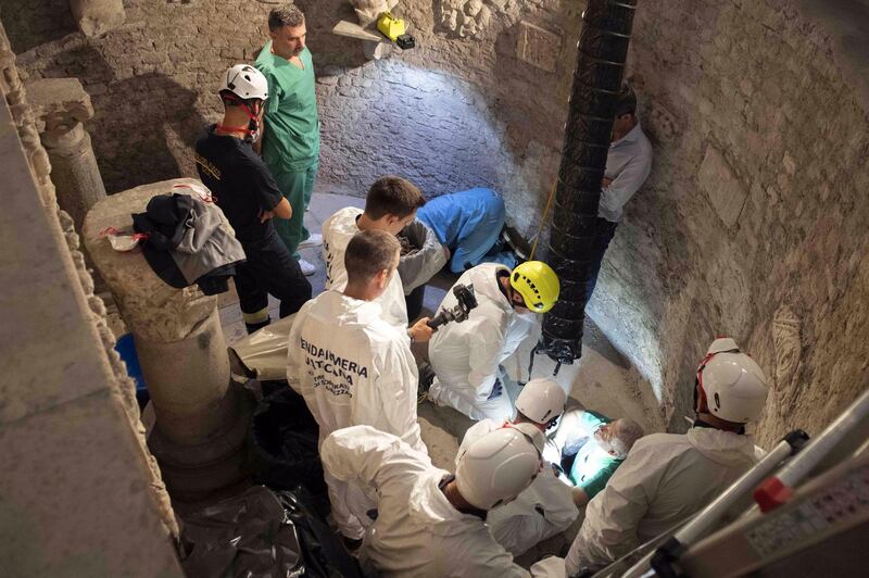 epa07729097 A handout picture provided by the Vatican Media shows experts opening the ossuary at the Teutonic Cemetery, to help solve the 36-year-old disappearance of Italian teenager Emanuela Orlandi, in Vatican City, 20 July 2019. Emanuela Orlandi, the daughter of a Vatican worker, disappeared in June 1983 at the age of 15. The Vatican has opened two burial chambers on the day as part of an investigation aimed at resolving the mystery case.  EPA/VATICAN MEDIA HANDOUT  HANDOUT EDITORIAL USE ONLY/NO SALES