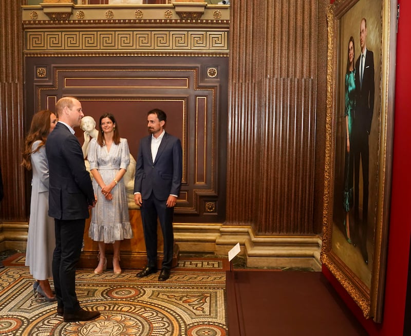 Prince William and his wife Kate visit the Fitzwilliam Museum in Cambridge to view a portrait of themselves as it is revealed to the public for the first time. AP 