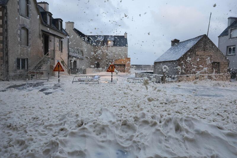 Foam in the streets of Penmarch, western France, as Storm Ciaran hits the region. AFP