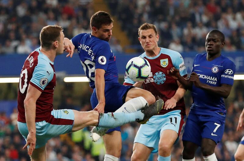 Burnley's Ashley Barnes and Chris Wood in action with Chelsea's Cesar Azpilicueta and N'Golo Kante. Reuters
