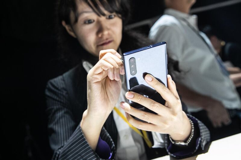 An attendee holds a Samsung Galaxy Note 10 phone. Bloomberg