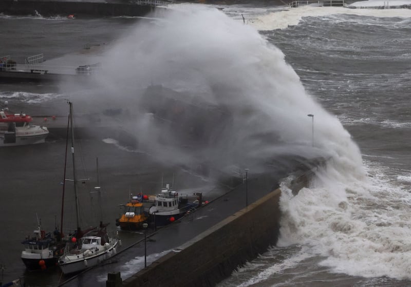 Waves crash over the harbour wall in Stonehaven, Kincardineshire, north-east Scotland. Reuters