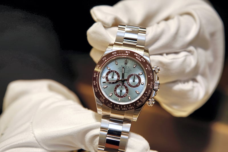 A salesperson stands for a photograph with the Rolex Daytona 50th anniversary watch at the GEARYS Rodeo Drive Rolex store in Beverly Hills, California, U.S., on Monday, Dec. 9, 2013. Photographer: Patrick T. Fallon/Bloomberg