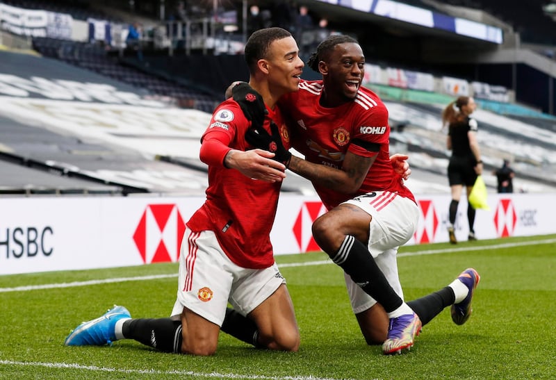 Mason Greenwood, left, celebrates scoring United's third goal with Aaron Wan-Bissaka. Reuters