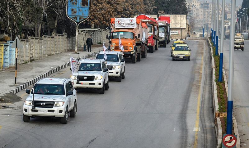 epa06572157 A handout photo made available by the Syrian Arab Red Crescent (SARC) shows a convoy of trucks carrying aid material heading to Afrin and Tall Riffat districts in the countryside of Aleppo, Syria, 01 March 2018. According to the official Syrian Arab NEWs Agency (SANA), a convoy of 28 trucks, carrying food and health materials and other relief goods, entered the crossing of al-Zyiara heading for Afrin area under the supervision of the Syrian Arab Red Crescent (SARC) and the International Committee of the Red Cross (ICRC). Turkey on 20 January 2018 launched its military operation into Afrin in a bid to clear the region of Kurdish YPG militias.  EPA/SARC HANDOUT  HANDOUT EDITORIAL USE ONLY/NO SALES