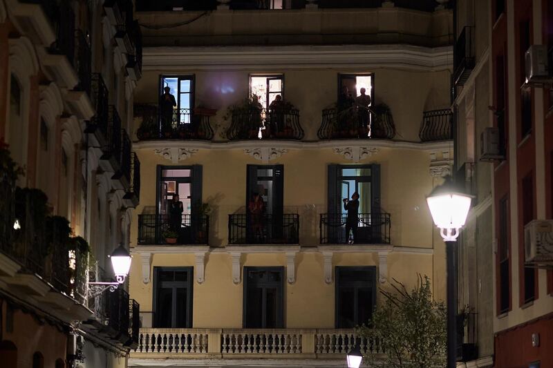 People applaud Spanish health workers in Madrid, Spain. Getty Images