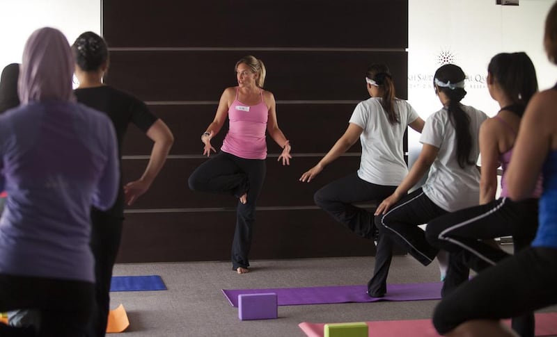 Liz Terry, founder of Satya Flow Yoga in Dubai, leads a yoga and meditation class at the Al Qasimi Centre in Ras Al Khaimah. Sarah Dea/The National