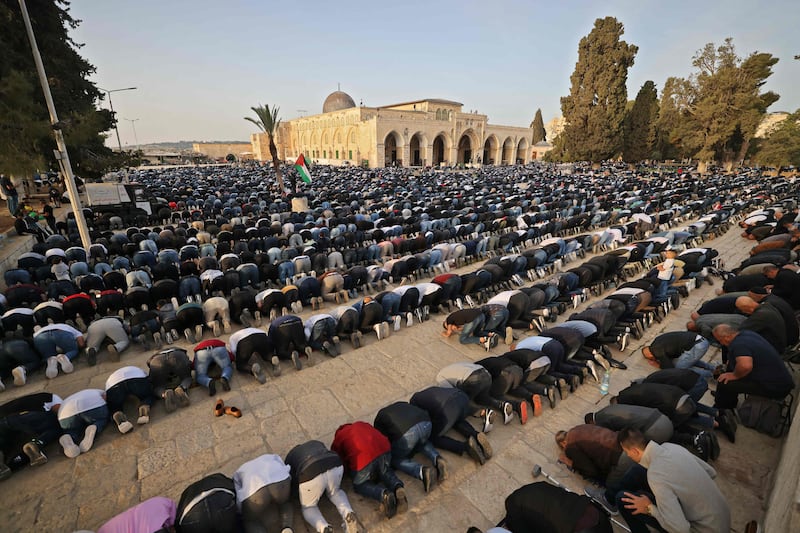 Muslims take part in morning Eid Al Fitr prayers, marking the end of Ramadan, at Al Aqsa compound in Old Jerusalem. AFP