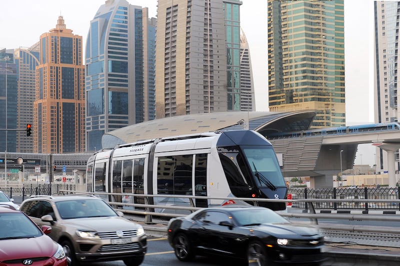 The tram, pictured, and metro both run through Dubai Marina to keep cars off the busy roads