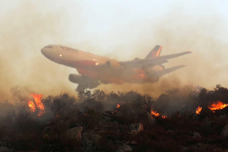 An plane drops retardant on the Fairview Fire near Hemet, California, on September 6. Reuters