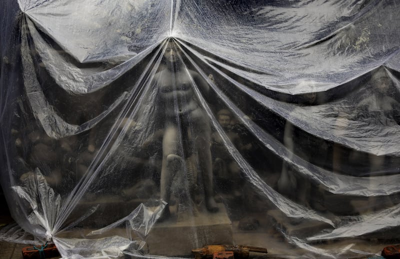 An unfinished idol of Goddess Durga is protected from the rain at Kumartuli district before the Durga Puja festival in Kolkata, India.  Bengalis all over the world will mark the festival, which represents the victory of good over evil and the celebration of female power, from October 1-5.   EPA