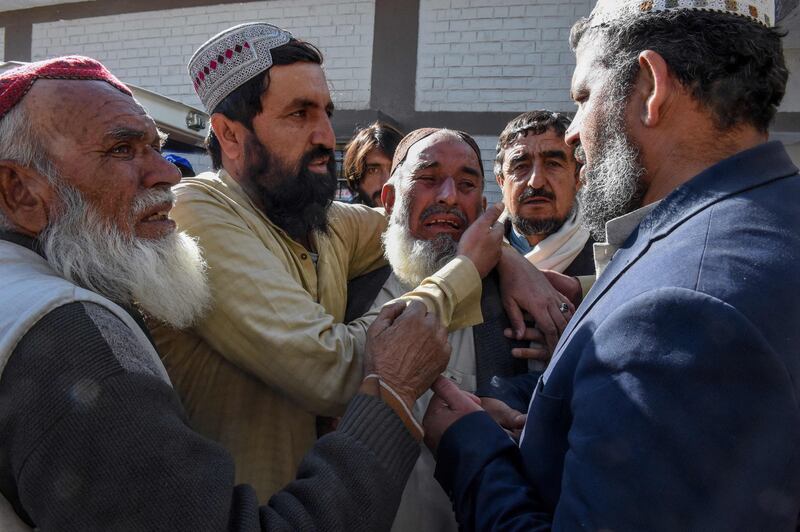 Relatives mourn the death of victims after a bomb blast outside the office of an independent candidate in Pishin district, about 50km from Quetta. AFP