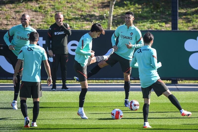 Portugal's forward Cristiano Ronaldo (2R) attends a training session with teammates at the Cidade do Futebol training ground in Oeiras, on November 13, 2021, on the eve of their FIFA World Cup Qatar 2022 qualifying football match against Serbia.  (Photo by PATRICIA DE MELO MOREIRA  /  AFP)