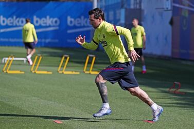 This handout pictured made available by FC Barcelona shows Barcelona's Argentine forward Lionel Messi attending a training session at the Ciutat Esportiva Joan Gamper in Sant Joan Despi on May 18, 2020. - RESTRICTED TO EDITORIAL USE - MANDATORY CREDIT "AFP PHOTO / HANDOUT / FC BARCELONA / MIGUEL RUIZ" - NO MARKETING - NO ADVERTISING CAMPAIGNS - DISTRIBUTED AS A SERVICE TO CLIENTS / AFP / FC BARCELONA / Miguel RUIZ / RESTRICTED TO EDITORIAL USE - MANDATORY CREDIT "AFP PHOTO / HANDOUT / FC BARCELONA / MIGUEL RUIZ" - NO MARKETING - NO ADVERTISING CAMPAIGNS - DISTRIBUTED AS A SERVICE TO CLIENTS