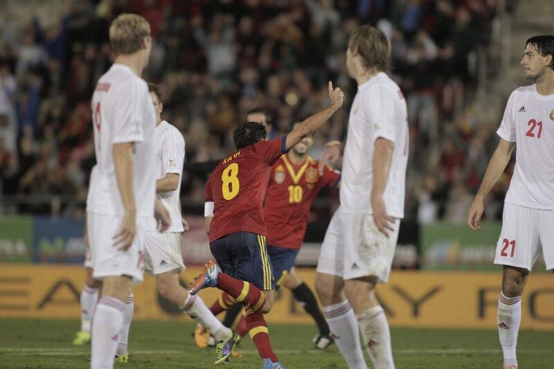 Spain 2-1 Belarus. Xavi scored in the 61st minute and Alvaro Negredo scored in the 78th to bring the world champions within a point of qualification. Manu Mielniezuk / AP
