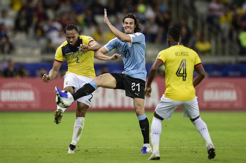 Edinson Cavani of Uruguay fights for the ball with Arturo Mina of Ecuador during the Copa America Brazil 2019 group C match between Uruguay and Ecuador at Mineirao Stadium in Belo Horizonte, Brazil. Getty Images