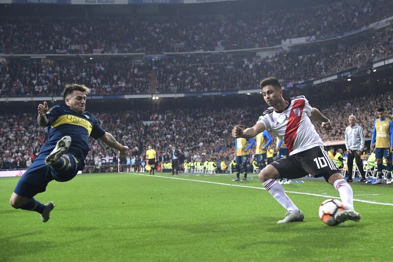 River Plate's Gonzalo Martinez is challenged by Boca Juniors' Julio Buffarini. AFP/Javier SORIANO