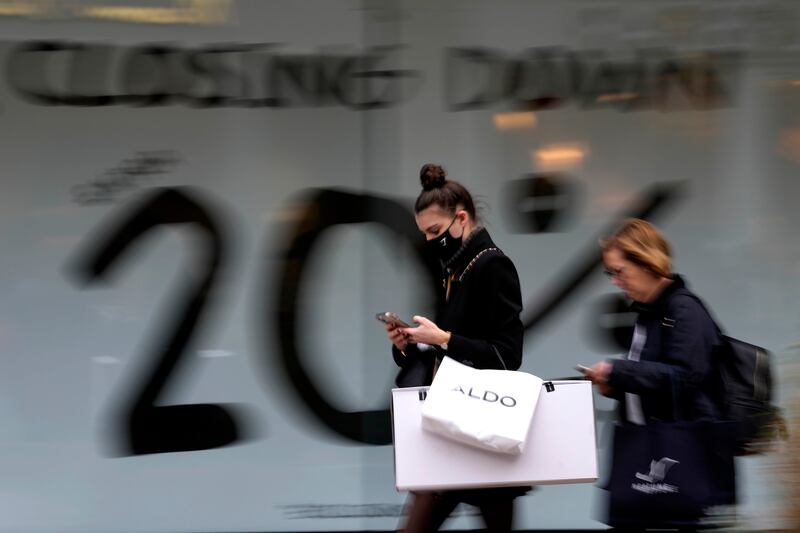 Shoppers walk along Oxford Street in London. The supply chain crisis is far from over, experts say. Photo: AP
