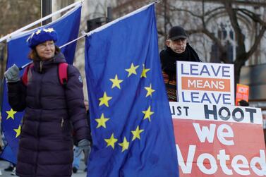 Protesters hold placards and flags as they demonstrate near the Houses of Parliament. AFP