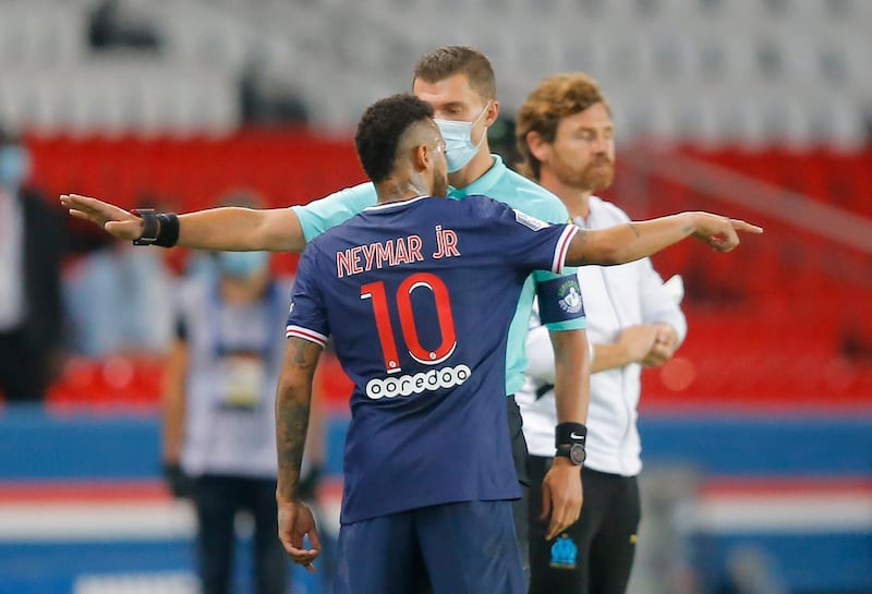 PSG's Neymar argues with the fourth official as he leaves the pitch. AP