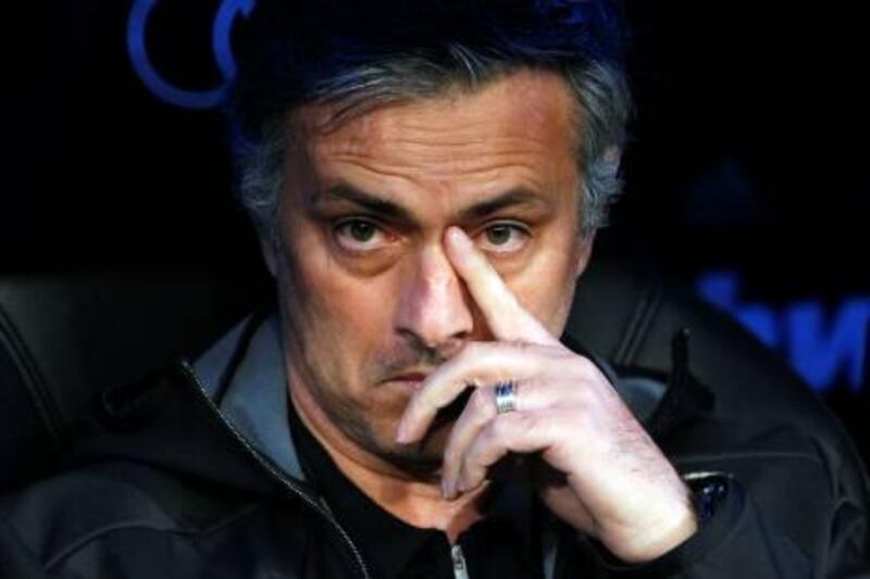 Real Madrid's coach Jose Mourinho from Portugal gestures during a Spanish La Liga soccer match against Athletic Bilbao at the Santiago Bernabeu stadium in Madrid, Spain, Sunday, Jan. 22, 2012. (AP Photo/Andres Kudacki) *** Local Caption ***  Spain Soccer La Liga.JPEG-07d48.jpg