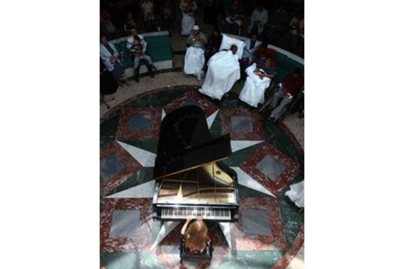 Prisca Benoit, a pianist from France performs at Sheikh Khalifa Medical City.