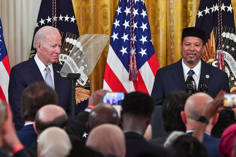 Dr  Talib Shareef speaks alongside US President Joe Biden during an Eid Al Fitr reception in the East Room of the White House. AFP