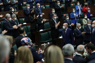 Turkish President Tayyip Erdogan greets members of his ruling AK Party during a meeting at the parliament?in Ankara, Turkey, December 23, 2020. Presidential Press Office/Handout via REUTERS ATTENTION EDITORS - THIS PICTURE WAS PROVIDED BY A THIRD PARTY. NO RESALES. NO ARCHIVE.