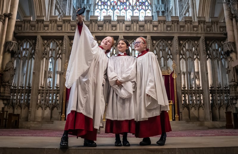 Choristers take a selfie during a press call at York Minister as the cathedral appeals for schoolgirls to audition for the choir. PA
