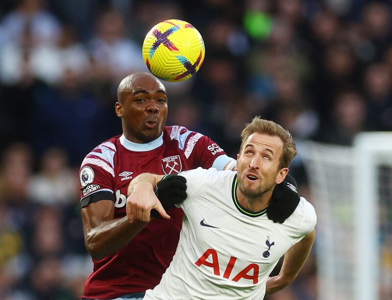 Tottenham Hotspur's Harry Kane in action with West Ham United's Angelo Ogbonna. Reuters