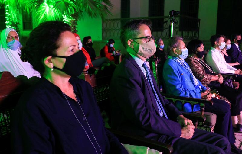 Spectators wearing protective masks and keeping social distance listen to the first concert from the Al Nour Wal Amal (Light and Hope) chamber orchestra for blind women at the Manasterly Palace in Cairo. Reuters