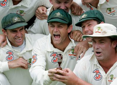 Matthew Hayden, Adam Gilchrist, captain Ricky Ponting and Shane Warne grip the replica urn after Australia regained the Ashes with a 206-run win in Perth. AFP
