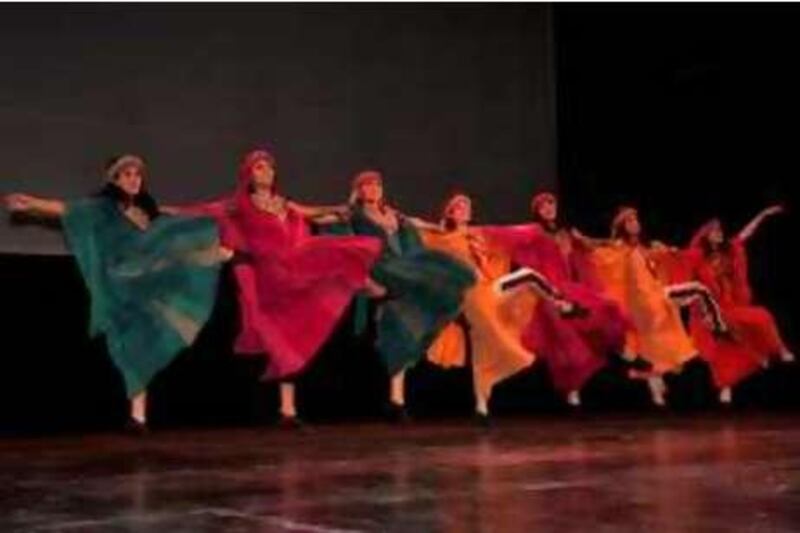 Members of the dance troupe El Funoun perform a version of the dabka at the Ramallah Cultural Palace during the Freedom Dance, December 20, 2008. The performance was shown live via satellite in the Gaza.

Jamal Aruri for The National *** Local Caption ***  06.jpg