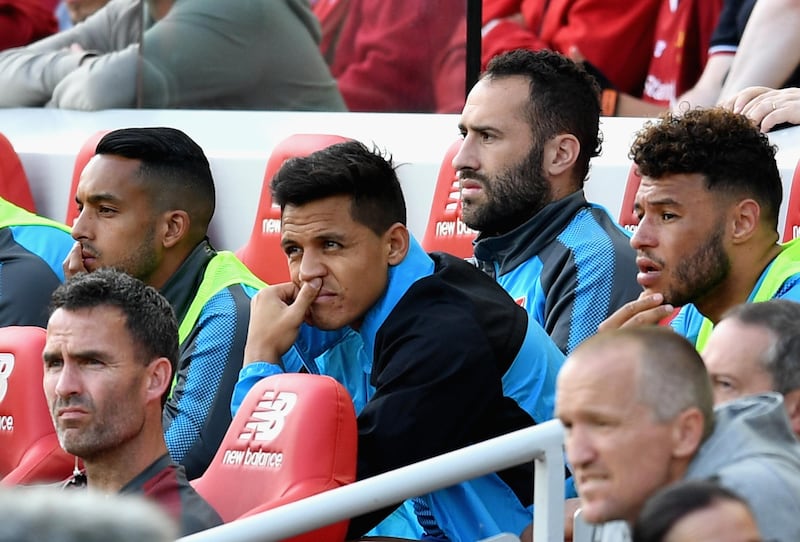 LIVERPOOL, ENGLAND - AUGUST 27: Alexis Sanchez of Arsenal looks on from the bench during the Premier League match between Liverpool and Arsenal at Anfield on August 27, 2017 in Liverpool, England.  (Photo by Michael Regan/Getty Images)