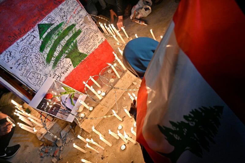 Anti-government protesters light candles after protester Ahmad Tawfik dies in Martyrs' Square in Beirut.  EPA