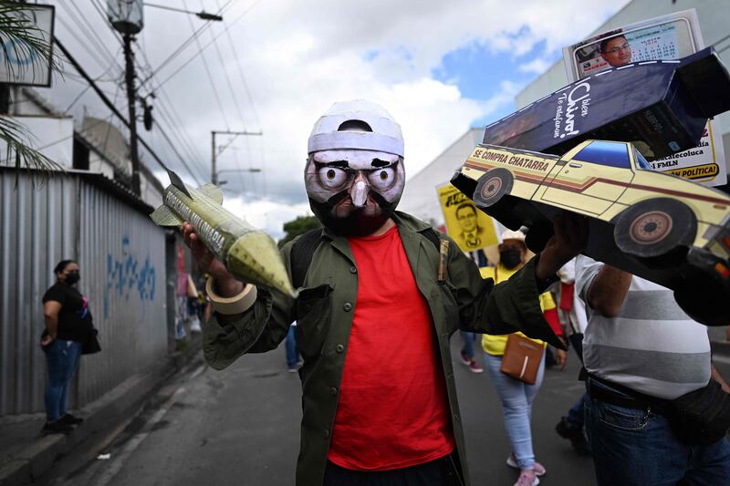 An opponent of the government of Salvadoran President Nayib Bukele during a protest against Mr Bukele's security policies, during El Salvador's 201st anniversary of independence in San Salvador. AFP
